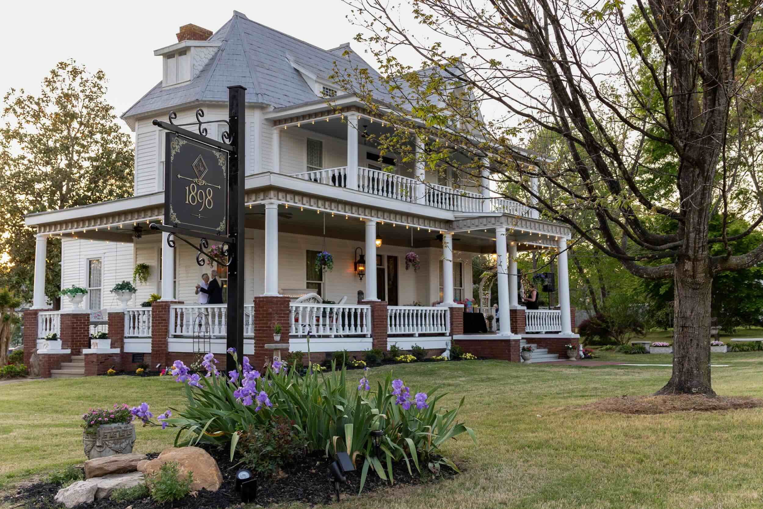 house with sign out front