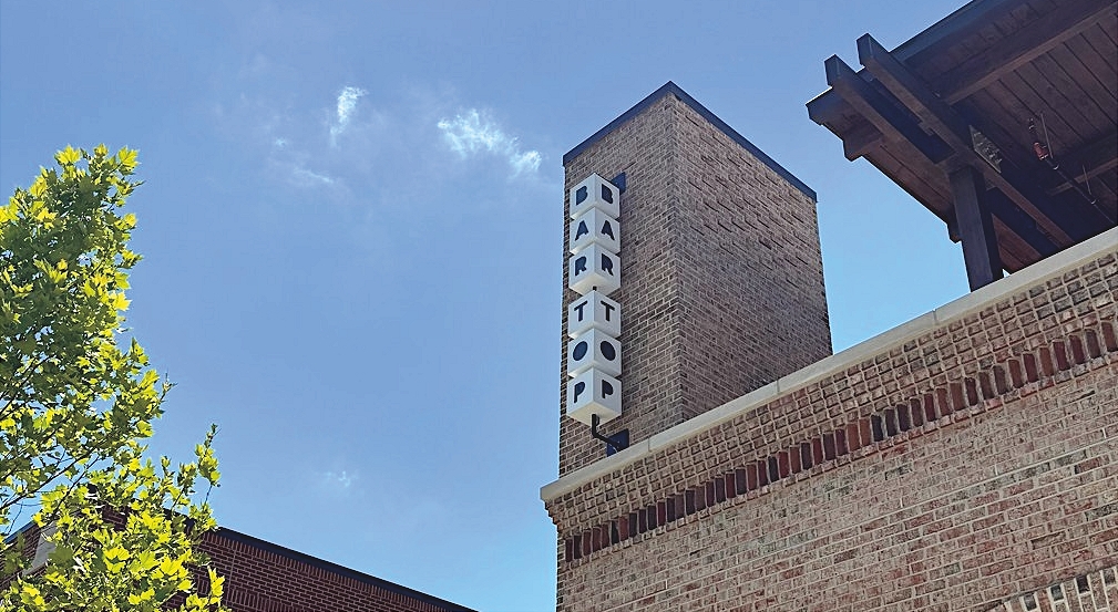 bartop lighted sign on building side