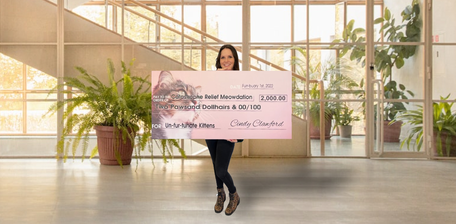 Woman holding a giant check