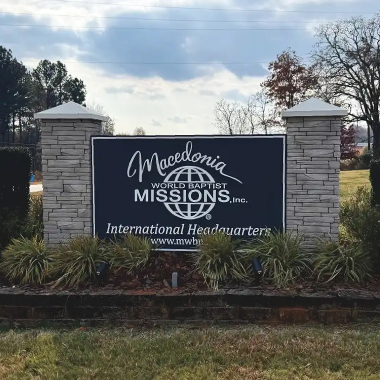 free standing monument sign made of bricks in grass area